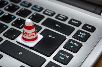 Keyboard image with caution cone.